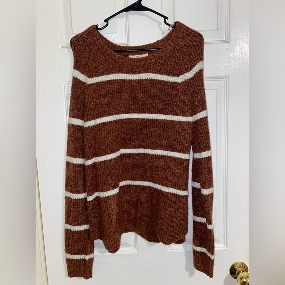 womens striped knit sweater with ruffle hem on the bottom!
